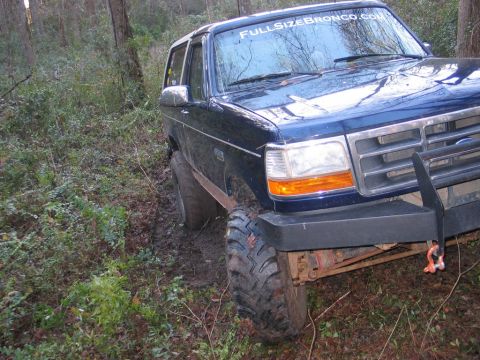 1995 Ford Bronco - This 1995 Ford Bronco is navigating a muddy, wooded trail.