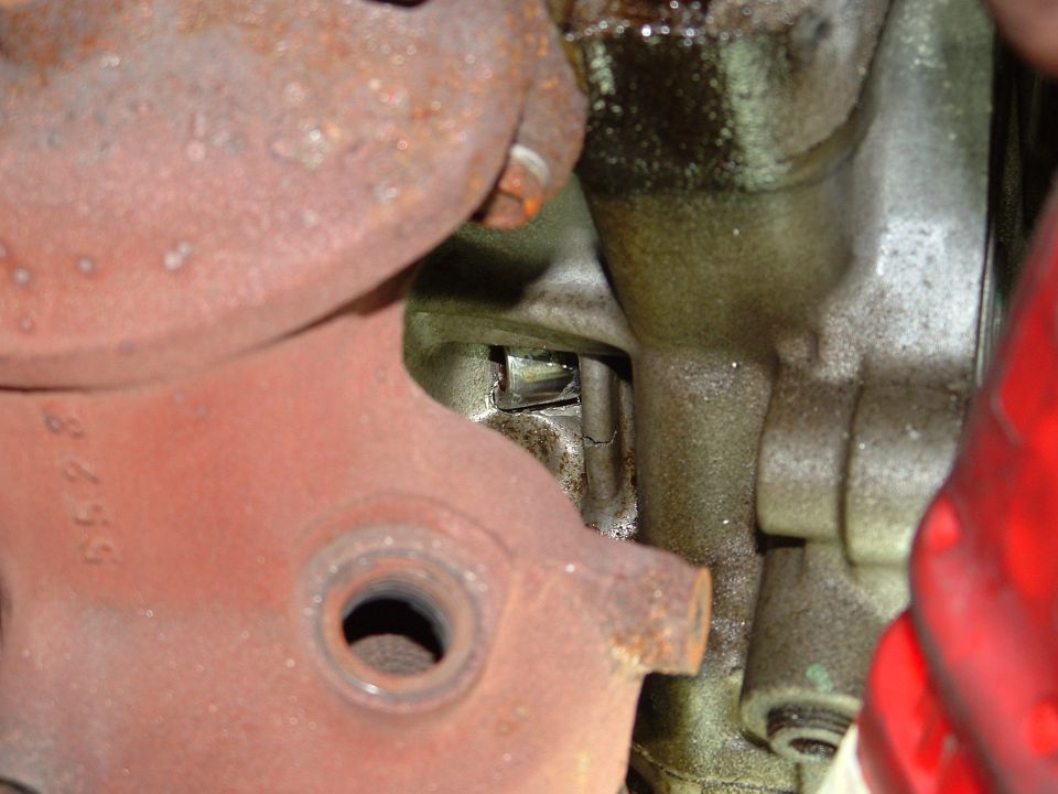Close-up of engine part with visible text '8655'