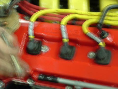 1996 Ford Probe - Engine spark plug wires and connectors are visible on a red component.