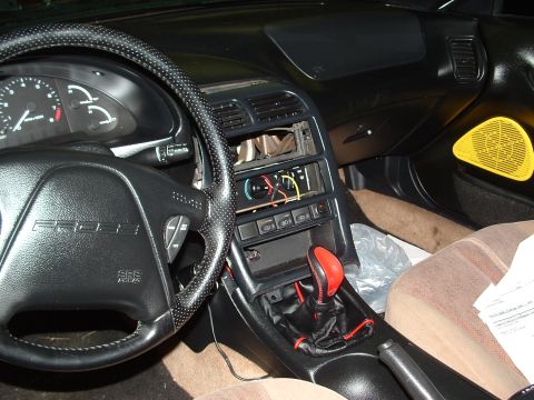 1996 Ford Probe - Interior view of a 1996 Ford Probe, the dashboard, steering wheel, and center console.