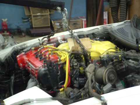 1996 Ford Probe - Engine bay components are visible, with a chain hoist overhead.