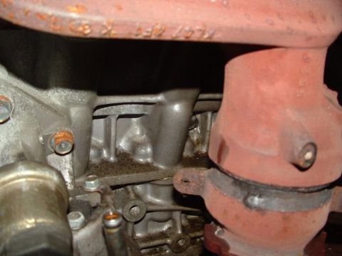 1996 Ford Probe - Close-up view of an engine's exhaust manifold, showing some wear and markings.