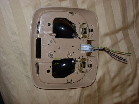 1998 Ford Crown Victoria - This is the underside of a vehicle's interior light fixture, showing the wiring and bulb holders.