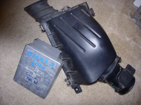 1998 Ford Crown Victoria - An engine control unit and air intake box are shown, with handwritten notes on the ECU indicating 'Chris A. Parts Del' and '3/27/09 98CV'.