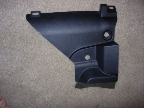 1998 Ford Crown Victoria - This is a black plastic trim piece, likely from a car's interior or exterior.