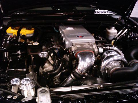 1986 Ford Bronco - Custom engine bay a large turbocharger and polished intake components.