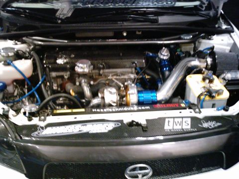 1986 Ford Bronco - Customized engine bay aftermarket turbocharger and intercooler components.