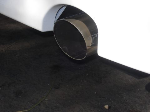 2006 Scion xB - A close-up view of a vehicle's exhaust pipe, a distinctive 'TT' logo etched into the metal.