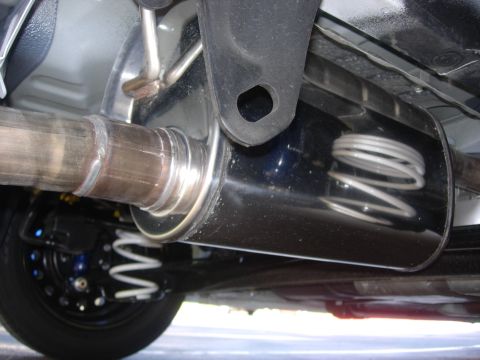2006 Scion xB - Underside view of the exhaust system and rear suspension components on a 2006 Scion xB.