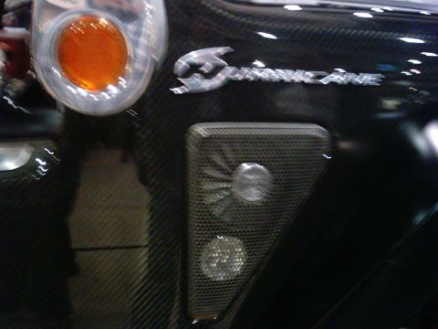 1986 Ford Bronco - Detail of a Superformance vehicle's rear, including taillight and emblem.