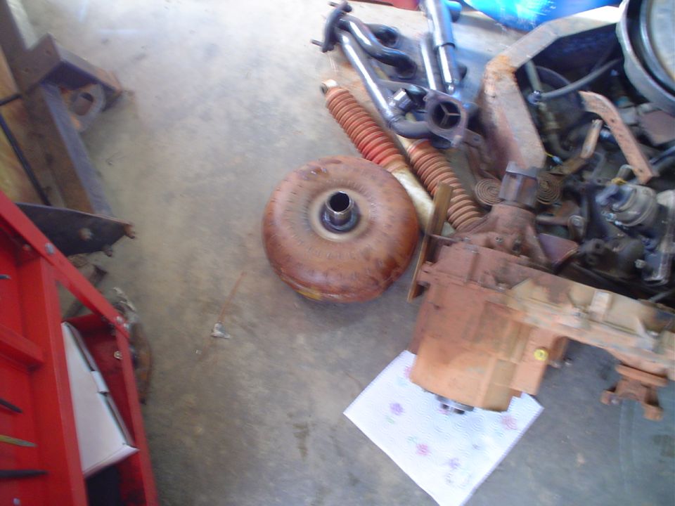 Vehicle transmission and torque converter on a concrete floor