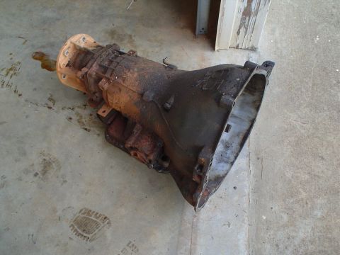 1984 Ford Bronco - This automatic transmission appears to be heavily used and is covered in dirt and grime.