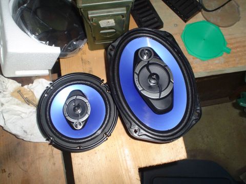 1984 Ford Bronco - A pair of Pioneer car speakers with blue cones are displayed on a wooden surface.