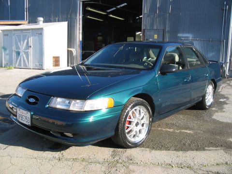 1995 Ford Taurus - Teal green 1995 Ford Taurus SHO with silver BBS-style wheels.