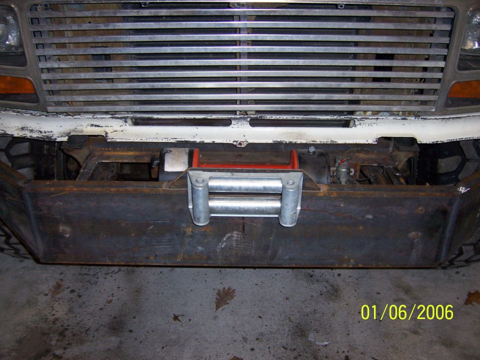 Custom bumper with winch on a vehicle front