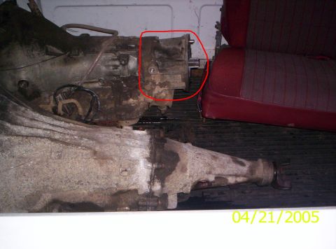 1985 Ford Bronco - A transmission assembly and red striped seats are visible inside a vehicle, dated 04/21/2005.