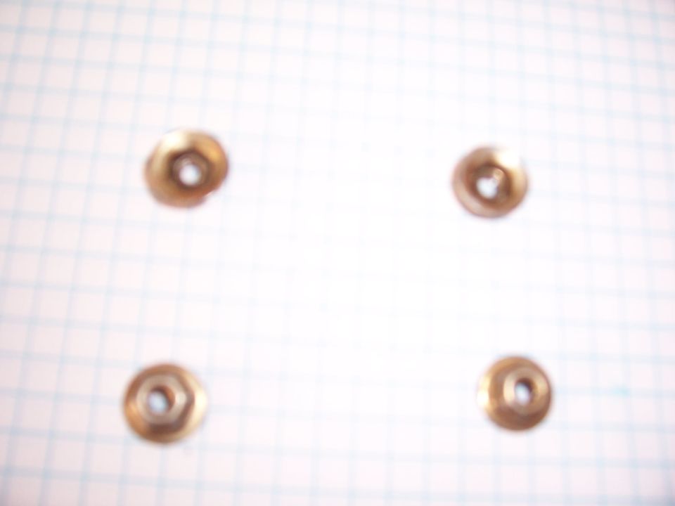These are what the eight nuts look like. They measure 11/32. Having an extension will make removing two of the bolts much easier.
