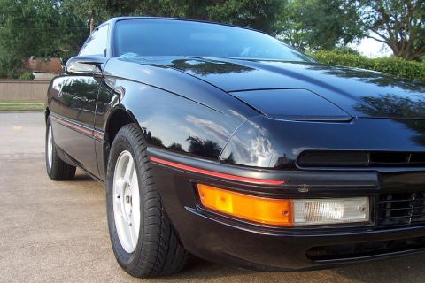 1990 Ford Probe - Stock-LX 3-qtr view - Typically has red trim pieces and digital dash boards. 3.0L V6 or 2.2L 4cly engine options. Year models 89-92.
