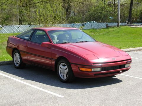 1990 Ford Probe - Stock LX 1st gen probe shown with stock wheels and hub caps.