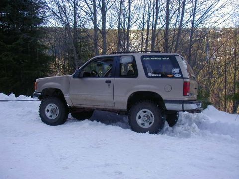 1994 Ford Explorer - A 1994 Ford Explorer navigates a snowy terrain, its off-road capabilities.