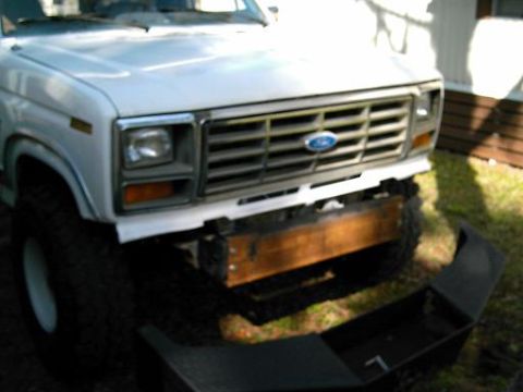 1986 Ford Bronco - Front view of a 1986 Ford Bronco showing a custom winch plate bumper installation.