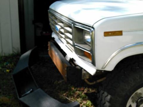 1986 Ford Bronco - Front view of a 1986 Ford Bronco, with a new bumper being installed.