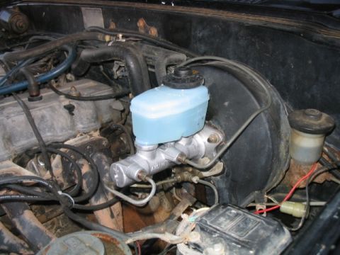 1986 Ford F-150 - The brake master cylinder and fluid reservoir are visible in the engine compartment.