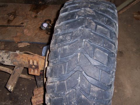 1983 Ford Bronco - Close-up of a tire and suspension part, likely from a truck or SUV.