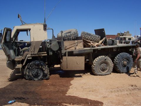 1978 Ford Bronco - Army 5-ton after sustaining IED damage. These trucks took a blast well thanks to the armor.