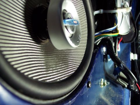 1995 Ford Probe - A blue fuse is visible within the car door speaker assembly.