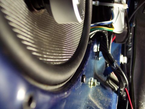 1995 Ford Probe - Car door speaker and wiring detail, with Supermotors.net logo in the corner.
