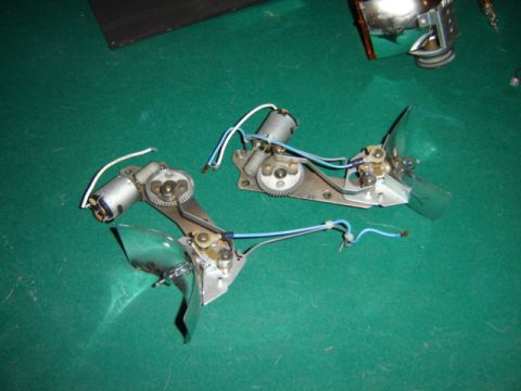 1992 Ford Bronco - Two electric motor assemblies with fans and wiring are laid out on a green surface.