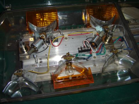 1992 Ford Bronco - This is a close-up view of the internal components of a vehicle's light assembly, showing wiring and bulbs.