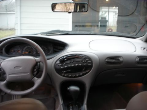 1998 Ford Taurus - Interior view of a 1998 Ford Taurus, showing the dashboard and center console.