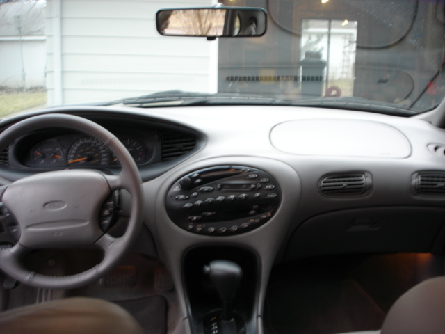 1998 Ford Taurus interior dashboard with steering wheel, gauges, and center console