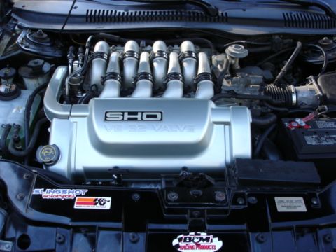 1998 Ford Taurus - Engine bay features a SHO V8 32 Valve cover, along with Slingshot Motorsports, K&N, and B&M Racing Products stickers.