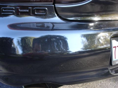 1998 Ford Taurus - Rear view of a 1998 Ford Taurus showing the SHO badging and bumper detail.