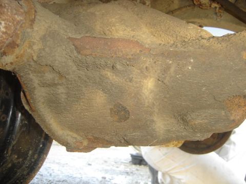 1994 Jeep Cherokee - Close-up view of a heavily rusted vehicle differential, indicating significant wear and age.