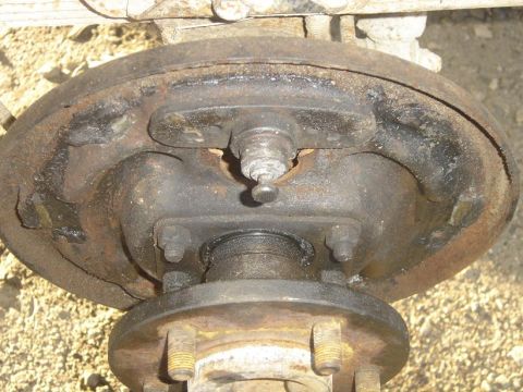 1994 Jeep Cherokee - This is a close-up view of a vehicle's rear drum brake assembly, showing wear and rust.