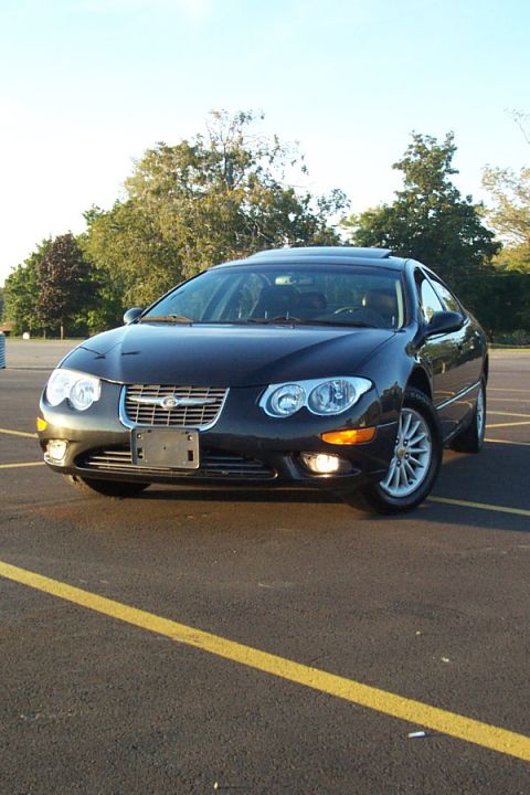 1999 Chrysler 300M - A 1999 Chrysler 300M is shown from the front in a parking lot with yellow lines.