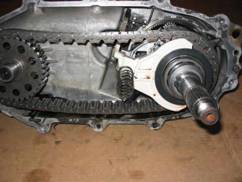 1995 Ford Bronco - Internal components of a transfer case, including gears and a drive chain.