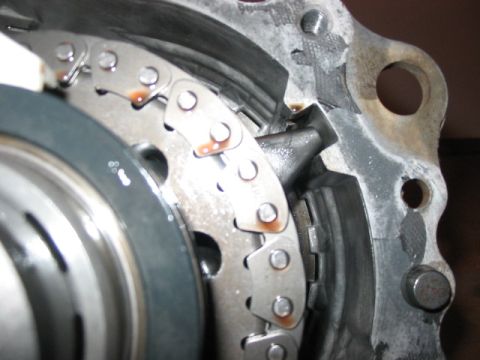 1995 Ford Bronco - Internal view of a transfer case component, highlighting the chain and gear mechanism.