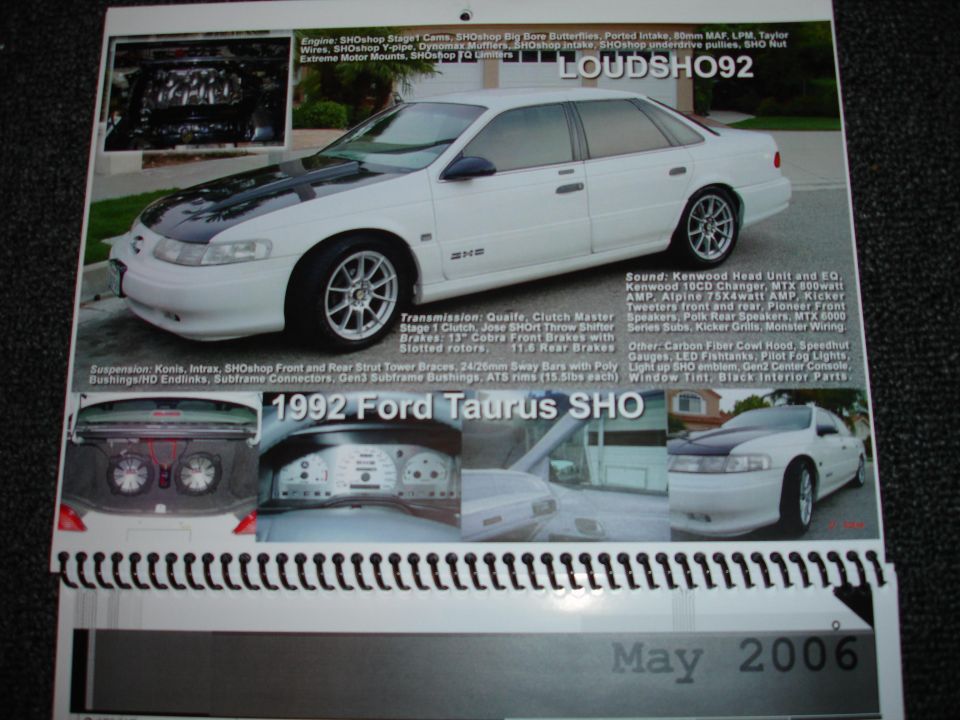 White 1992 Ford Taurus SHO sedan with black hood and aftermarket wheels