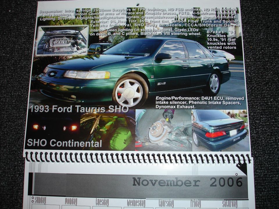 1993 Ford Taurus SHO sedan, green, with aftermarket wheels and spoiler