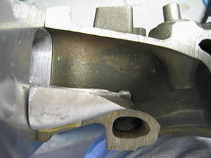 1972 Ford Ranchero - A close view of a metal component, possibly an engine part, with a SuperMotors logo visible.