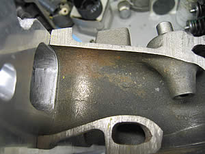 1972 Ford Ranchero - A close-up view of a machined engine component, the SuperMotors logo and website.