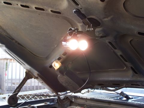 1986 Ford Bronco - Auxiliary lighting is installed under the hood for better visibility when working on the engine.
