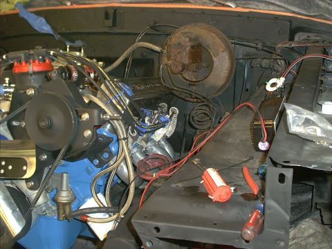1978 Ford Bronco - The engine bay shows various components and wiring, with tools scattered on the fender.