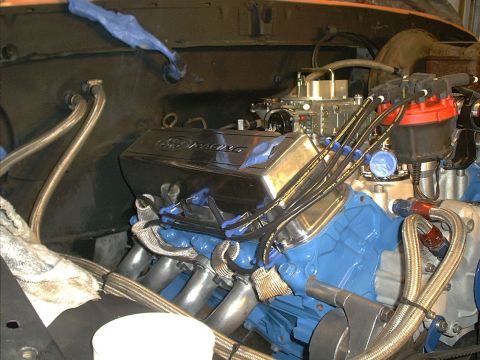 1978 Ford Bronco - Close-up view of a vehicle's engine compartment, highlighting the engine block and associated components.