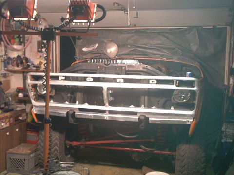 1978 Ford Bronco - The grille of a Ford truck is visible, with the word "FORD" spelled out across it.